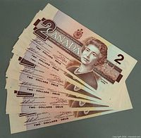 Obverse view fanned showing Queen Elizabeth II and denomination