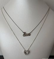 Both necklaces displayed on bust form