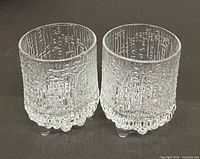 Front view of both textured shot glasses