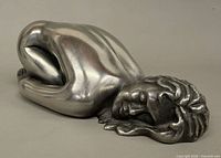 Left side view of pewter reclining nude figure