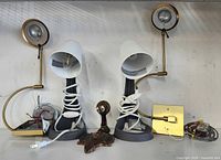 Two table lamps, two wall lights, wooden stand grouped