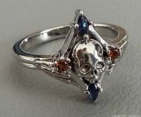Top view showing skull motif and gemstone accents