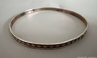Full view of the sterling silver bangle showing overall shape and pattern