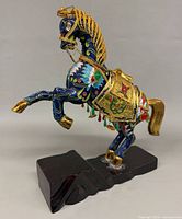 Front left view showing full horse and base