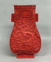 Front view showing full dragon carving and square foot