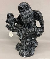 Front three-quarter view showing entire owl sculpture