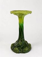 full view of green ceramic pedestal stand front
