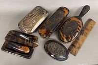 Group shot of all seven pieces showing materials and styles