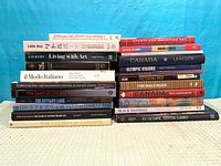 All 23 books stacked in two columns, spine titles visible
