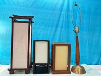 Front view of four lamps standing side by side showing sizes and styles