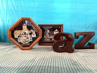 Full lot showing both framed cottage reliefs and ceramic letters a and Z