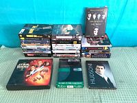 All DVDs laid out in three stacks plus front feature sets
