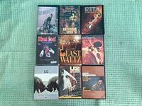 All nine DVD cases laid out in 3x3 grid, front covers visible