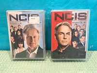 Front covers of both NCIS DVD box sets