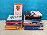Full view of both stacks showing all 16 books