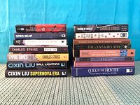 Two vertical stacks of books, all titles visible