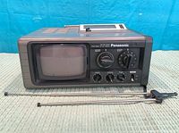 Front view showing CRT screen, control panel, antennas