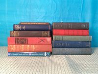 Two horizontal stacks showing all 11 book spines