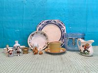 Group shot of all porcelain, ceramic and glass items in lot