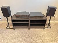 Front view showing both Denon components centered between two Royd speakers on stands
