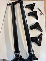 Two crossbars, four mounting feet, key tool