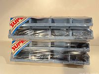 Two sealed Holt Super Tuff storage units stacked