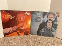 Both album covers front view