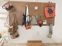 front view showing primary pegboard with tools and lower tool belt