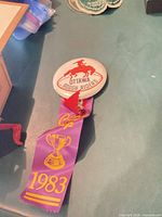 Front view of button and ribbon