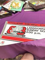 Full view of pennant on table showing logo and event details