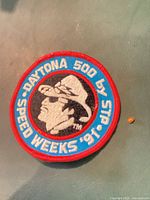 Front view of round Daytona 500 embroidered patch showing colors, text and graphic