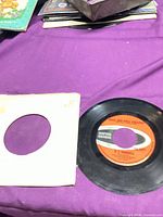 Vinyl record front with sleeve visible