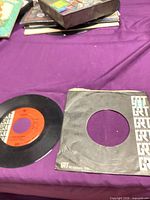 Vinyl single and GRT paper sleeve on table