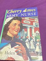 Front of book with illustrated dust jacket showing title and author