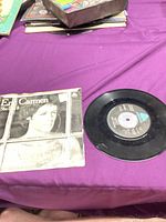 Record and picture sleeve on table