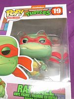 Front window view of Raphael POP! box showing figure, number 19, TMNT branding
