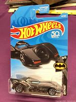 Front of sealed Hot Wheels Batmobile showing car, card art, 50th Anniversary logo, series 4/5