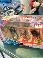 Front of sealed Johnny Lightning Marvel 3-car set in window box