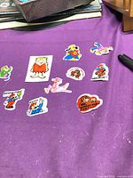 Full group of 10 stickers on purple background