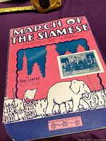 Front cover of March of the Siamese sheet music showing design and overall condition