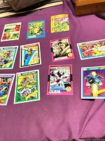 All ten Marvel trading cards laid out front-side up on purple background.