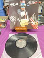 Front cover and vinyl record on inner sleeve