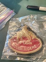 Front view of Ottawa Rough Riders patch in plastic