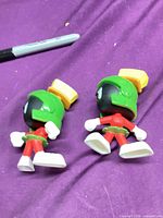 Two Marvin the Martian figures front view