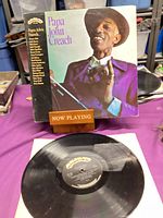 Front jacket and vinyl showing artist portrait and label