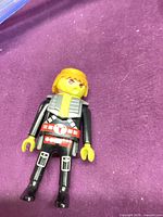 Front view of Playmobil space figure showing armor, belt and colors