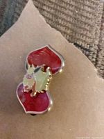 Front view showing Flareon on red heart background, gold trim