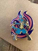 Front view of Lucario hard enamel pin showing design and colors
