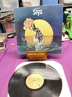 Front sleeve and vinyl record displayed