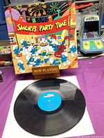Front cover of The Smurfs Party Time sleeve with vinyl displayed